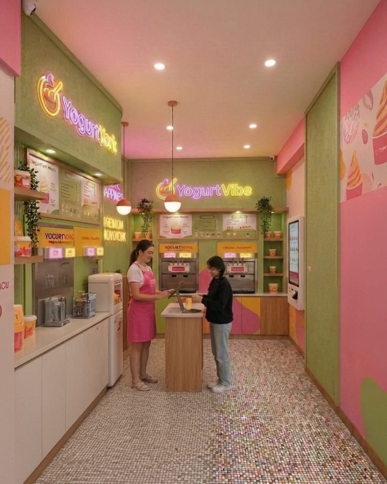 Interior of a YogurtYork frozen yogurt store with the counter and menu boards